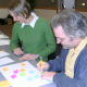 Linda Kalnejais and Timothy Moore, UNH scientists, construct concept maps on paper on the first day of the workshop