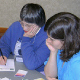 Marjorie Inderbitzen, Phyllis Appler, and Julianne Mueller-Northcott look at a variety of eye catching ocean-related images and try to come up with compelling story lines to go along with them