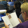 An educator scans the COSEE-OS booklet <i>Teaching Physical Concepts in Oceanography: An Inquiry Based Approach</i>