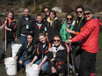 Gardiner Area High School science teacher, Sharon Gallant, and 10 students dig for worms in Lowe's Cove, Walpole, ME
